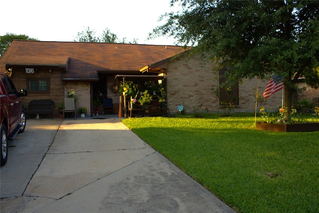 7126 Sawmill Trl, Houston, TX 77040 - view of front of house with a front lawn, brick siding, and concrete driveway