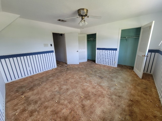 1601 15th St N, Texas City, TX 77590 - unfurnished bedroom with multiple closets, carpet, and a ceiling fan