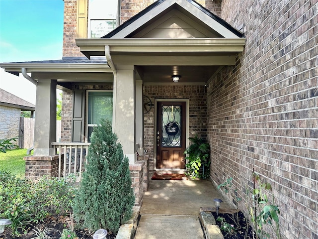 3110 Balch Springs Ln, Katy, TX 77449 - view of exterior entry featuring brick siding, covered porch, and stucco siding