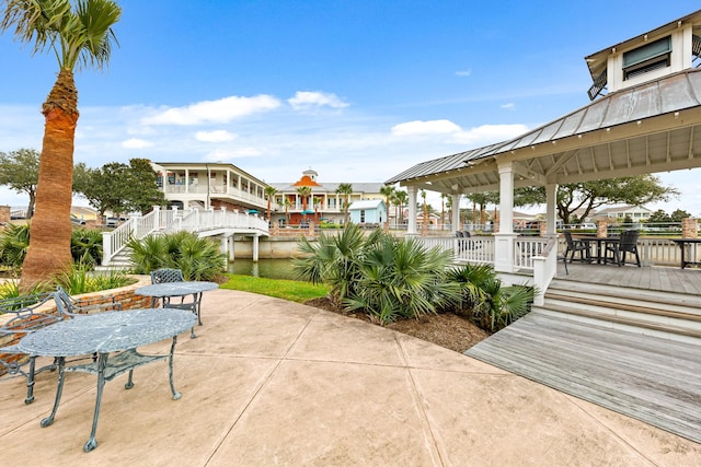 6 Compass Cir, Galveston, TX 77554 - view of home's community featuring a gazebo, a patio area, and stairs