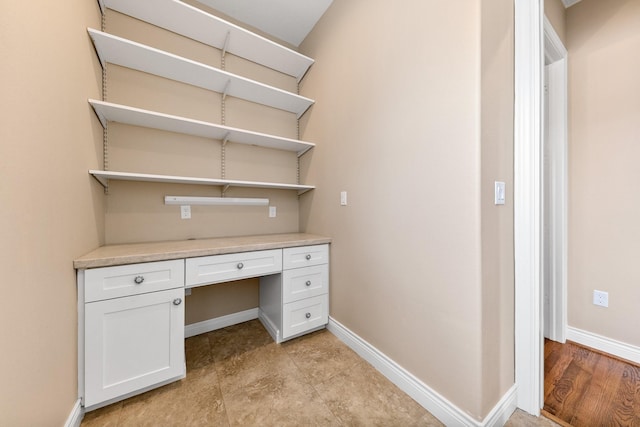 6 Compass Cir, Galveston, TX 77554 - unfurnished office featuring baseboards and built in study area