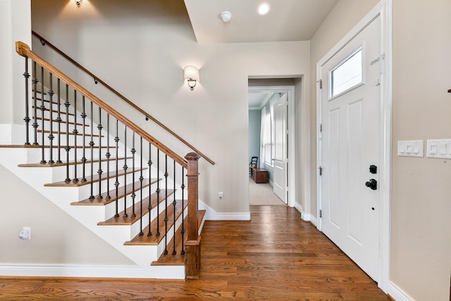 6 Compass Cir, Galveston, TX 77554 - entryway featuring baseboards, stairway, and wood finished floors