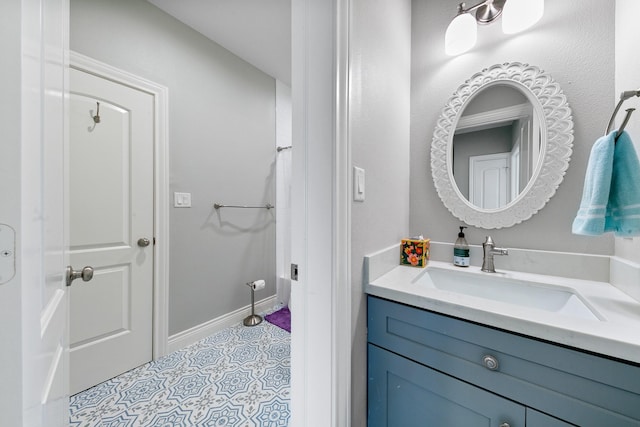 6 Compass Cir, Galveston, TX 77554 - bathroom featuring tile patterned floors, vanity, and baseboards