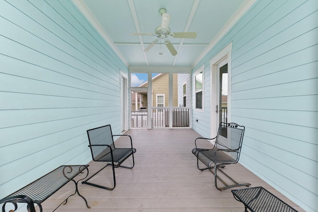6 Compass Cir, Galveston, TX 77554 - wooden deck with a ceiling fan