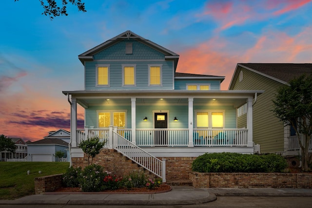 6 Compass Cir, Galveston, TX 77554 - view of front facade featuring covered porch and stairs