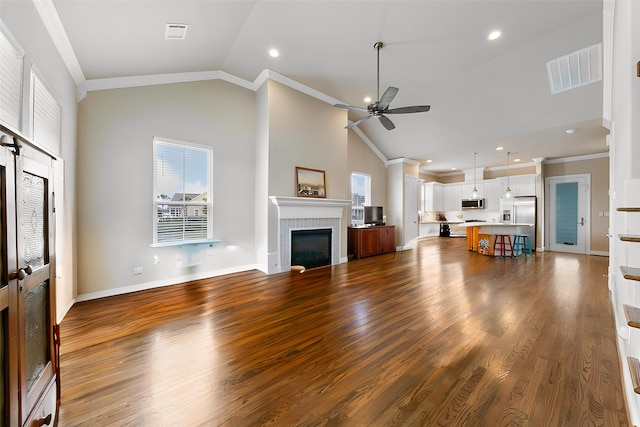 6 Compass Cir, Galveston, TX 77554 - living room featuring ornamental molding, ceiling fan, and a wealth of natural light