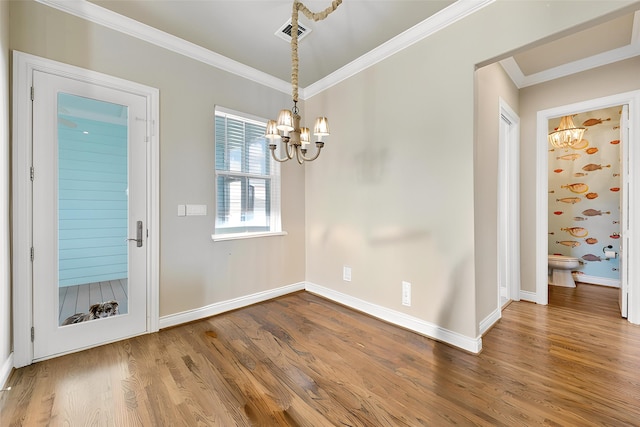 6 Compass Cir, Galveston, TX 77554 - unfurnished dining area with a chandelier, visible vents, baseboards, ornamental molding, and wood finished floors