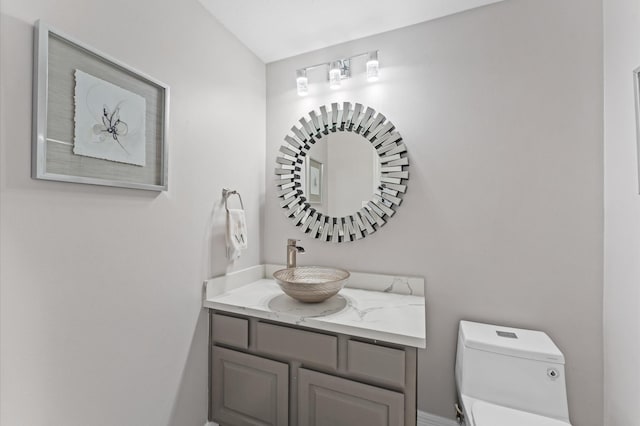 bathroom with vanity and toilet