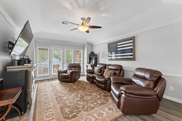 living area featuring visible vents, ornamental molding, wood finished floors, french doors, and a ceiling fan