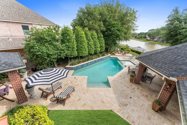 outdoor pool with a water view, outdoor dining area, and a patio area