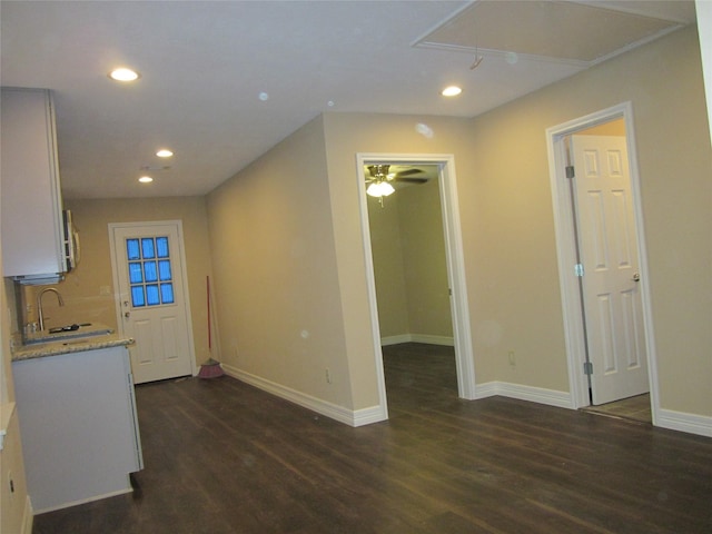interior space with attic access, baseboards, dark wood-style flooring, and recessed lighting