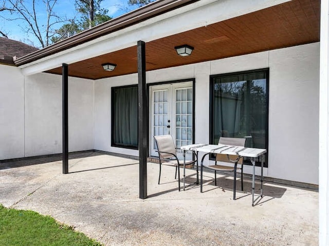 view of patio / terrace featuring french doors and outdoor dining space