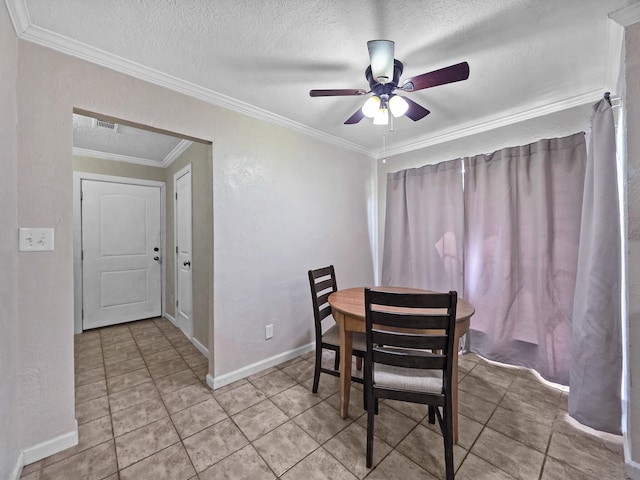 dining area featuring crown molding, a ceiling fan, a textured ceiling, and light tile patterned floors