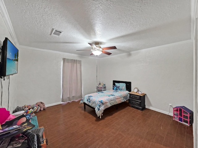 bedroom with wood finished floors, visible vents, ornamental molding, baseboards, and a textured ceiling