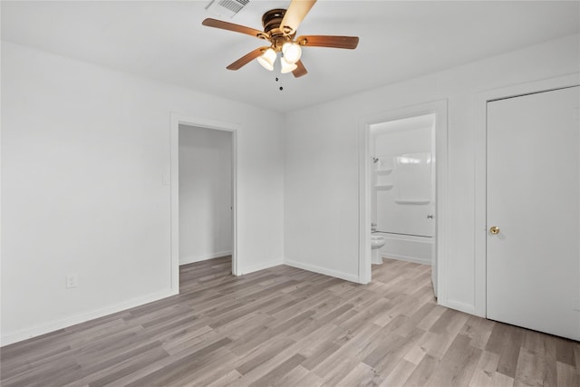 unfurnished bedroom with light wood finished floors, baseboards, visible vents, a ceiling fan, and connected bathroom
