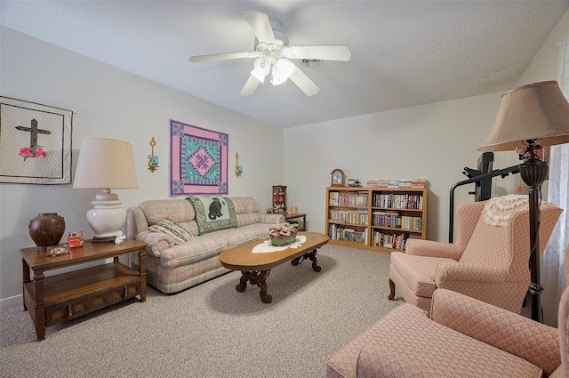 carpeted living room with a ceiling fan