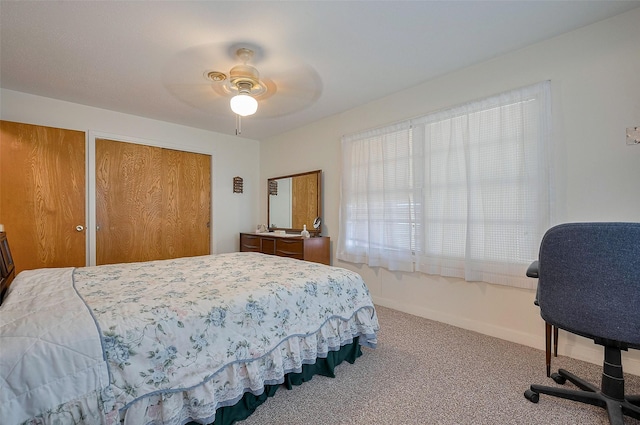 bedroom featuring baseboards, carpet flooring, and ceiling fan