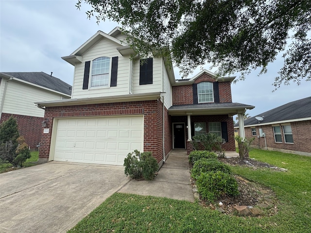 traditional-style home featuring a front lawn, driveway, covered porch, brick siding, and an attached garage