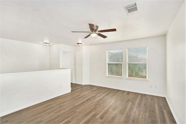 1722 Caldbeck Ln, Fresno, TX 77545 - unfurnished room with baseboards, ceiling fan, wood finished floors, and visible vents