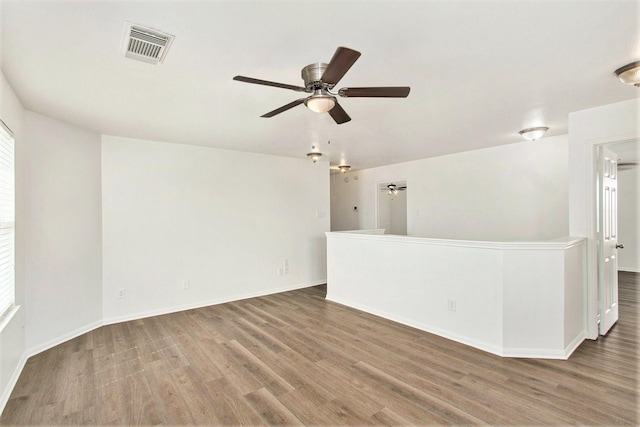 1722 Caldbeck Ln, Fresno, TX 77545 - unfurnished room with a ceiling fan, baseboards, visible vents, and wood finished floors