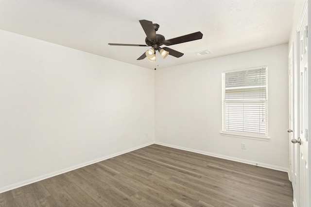 1722 Caldbeck Ln, Fresno, TX 77545 - spare room featuring baseboards, dark wood-style flooring, ceiling fan, and visible vents