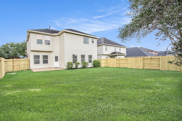 1722 Caldbeck Ln, Fresno, TX 77545 - rear view of property featuring a lawn, a patio, and a fenced backyard