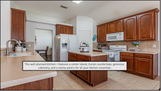 1814 S Everglades Dr, Deer Park, TX 77536 - kitchen featuring white appliances, a sink, backsplash, light countertops, and a kitchen island