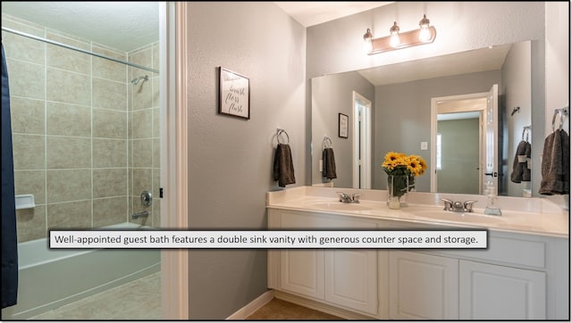 1814 S Everglades Dr, Deer Park, TX 77536 - bathroom with a textured wall, double vanity, and bathtub / shower combination