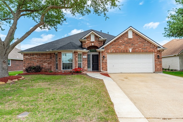 1814 S Everglades Dr, Deer Park, TX 77536 - traditional home with brick siding, concrete driveway, an attached garage, and a front lawn