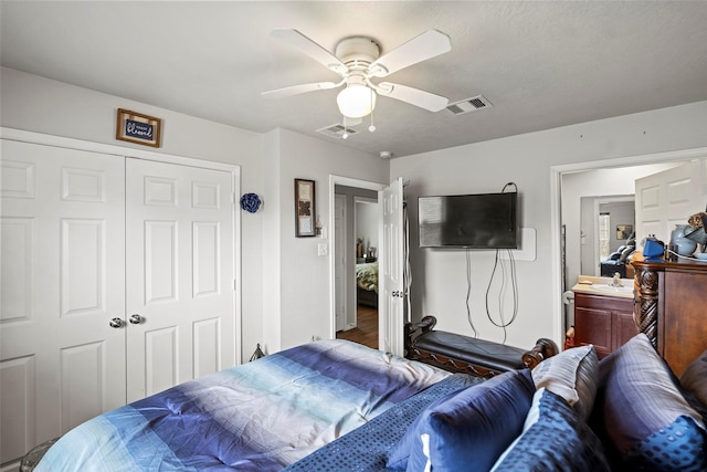 bedroom with a ceiling fan, a sink, visible vents, and a closet
