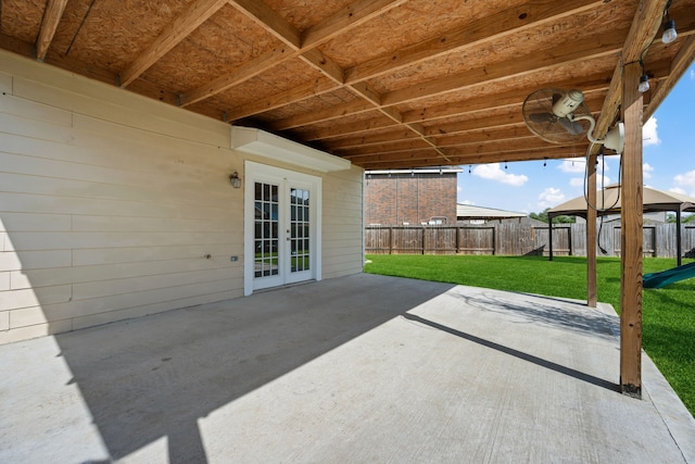 view of patio featuring a fenced backyard and french doors