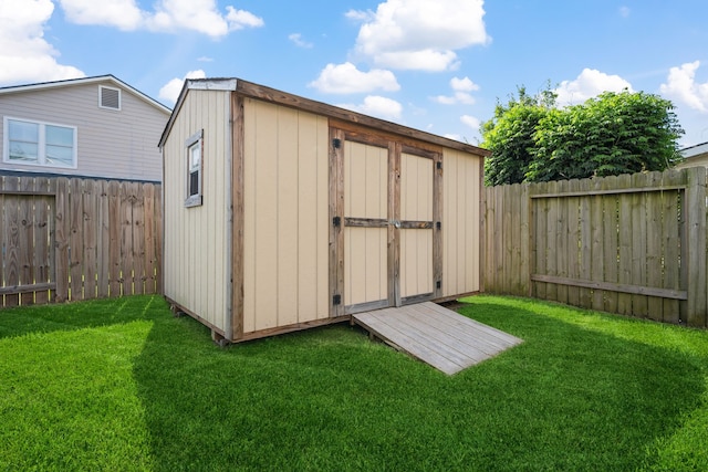 view of shed featuring a fenced backyard
