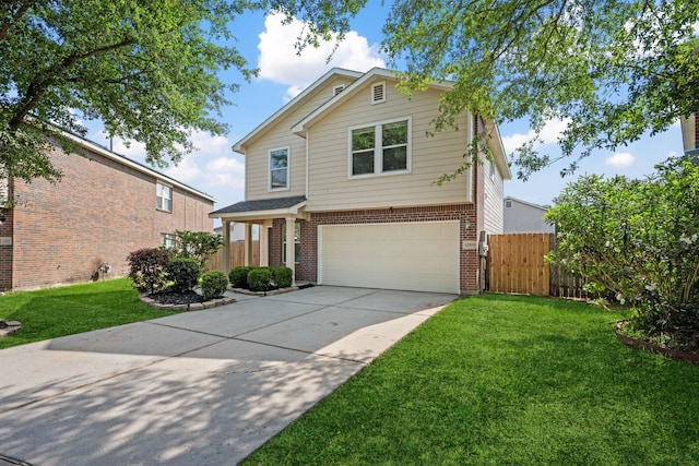 traditional home with a front lawn, a garage, driveway, brick siding, and fence