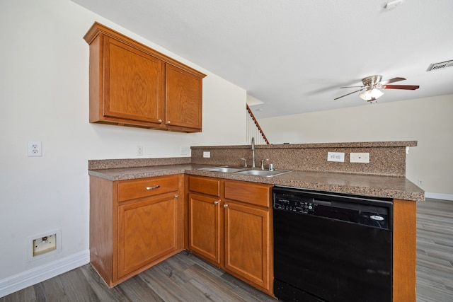 kitchen featuring a sink, black dishwasher, ceiling fan, a peninsula, and baseboards