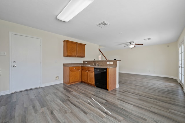 kitchen featuring visible vents, ceiling fan, open floor plan, dishwasher, and light wood finished floors