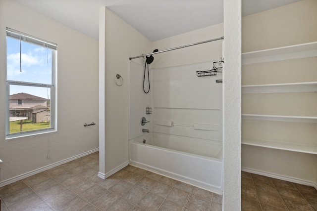 full bathroom featuring shower / bath combination and baseboards