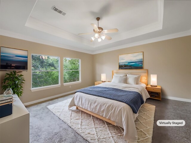 12620 Briar Patch Rd, Houston, TX 77077 - bedroom featuring a ceiling fan, a tray ceiling, baseboards, ornamental molding, and visible vents