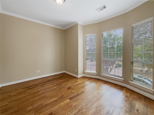 12620 Briar Patch Rd, Houston, TX 77077 - unfurnished room featuring wood finished floors, visible vents, crown molding, and baseboards