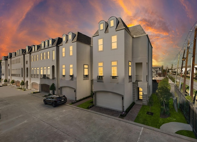 11120 Savannah Woods Ln, Houston, TX 77043 - view of property with stucco siding and roof with shingles