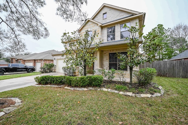 view of front of property with concrete driveway, a front yard, fence, brick siding, and a garage