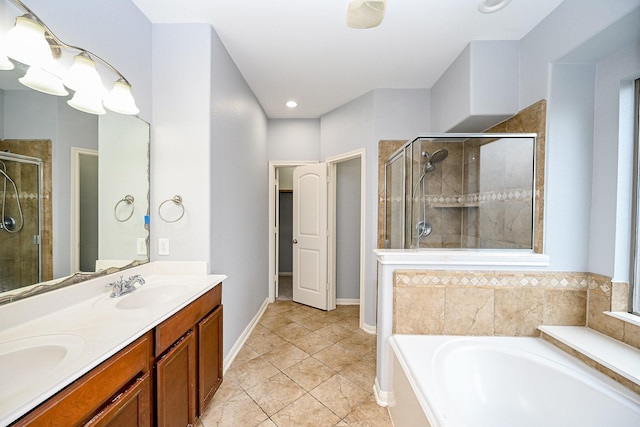 bathroom with a garden tub, a shower stall, and a sink