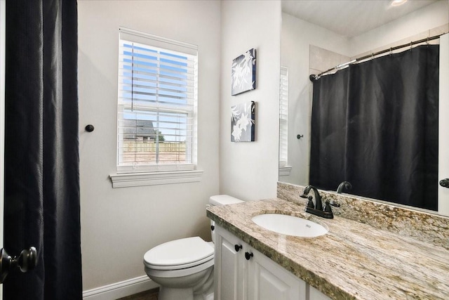 9345 Phelan Blvd, Beaumont, TX 77706 - full bath featuring a shower with shower curtain, a healthy amount of sunlight, toilet, and vanity