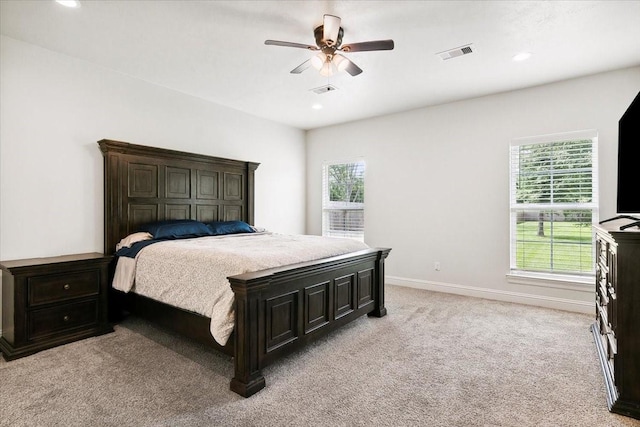 9345 Phelan Blvd, Beaumont, TX 77706 - bedroom with baseboards, visible vents, light colored carpet, and multiple windows