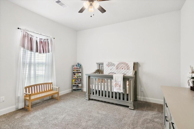 9345 Phelan Blvd, Beaumont, TX 77706 - bedroom with a ceiling fan, a crib, carpet floors, baseboards, and visible vents