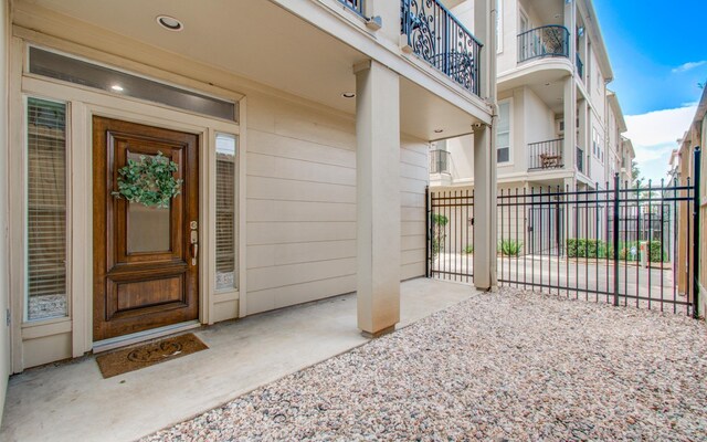 property entrance with fence