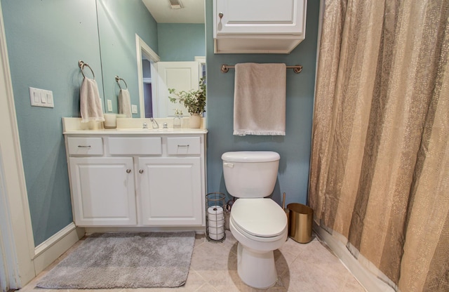 bathroom with visible vents, vanity, tile patterned flooring, and toilet