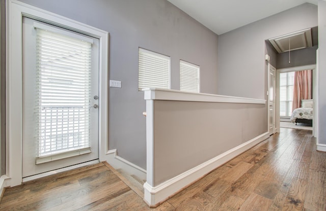 entryway featuring wood finished floors and baseboards