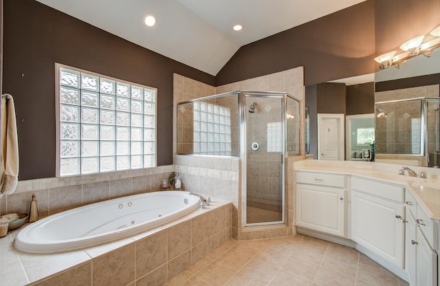 full bath with lofted ceiling, a jetted tub, tile patterned flooring, and a stall shower