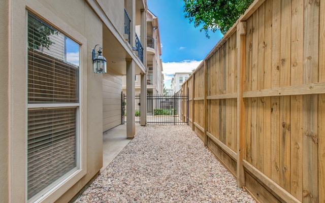 view of side of property with a patio area and fence