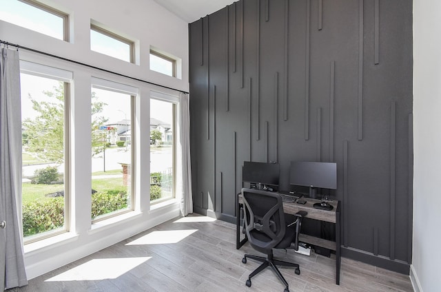 office with light wood-style flooring and baseboards